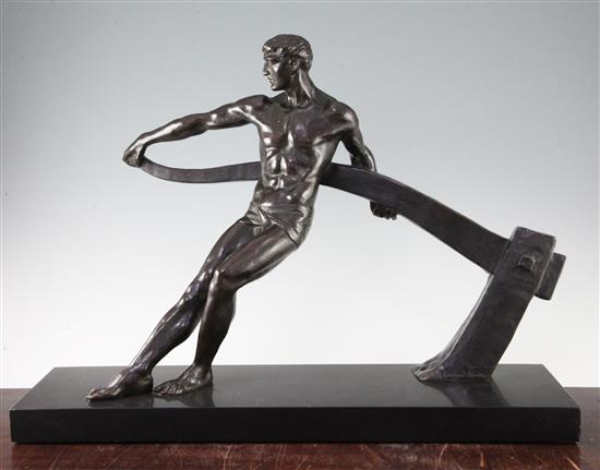 Maurice Guiraud-Riviere (French, b.1881). A patinated bronze model of a male figure working a tiller, 24.5in.